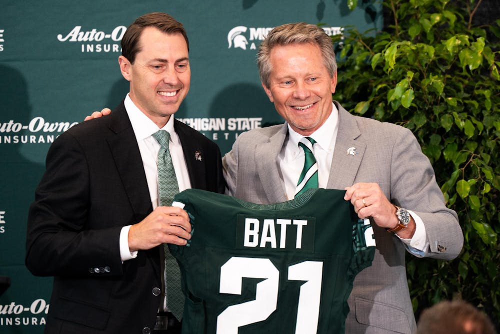 <p>Michigan State University President Kevin Guskiewicz and new Vice President and Athletic Director J Batt pose for a photo in East Lansing, Michigan on June 4, 2025.</p>