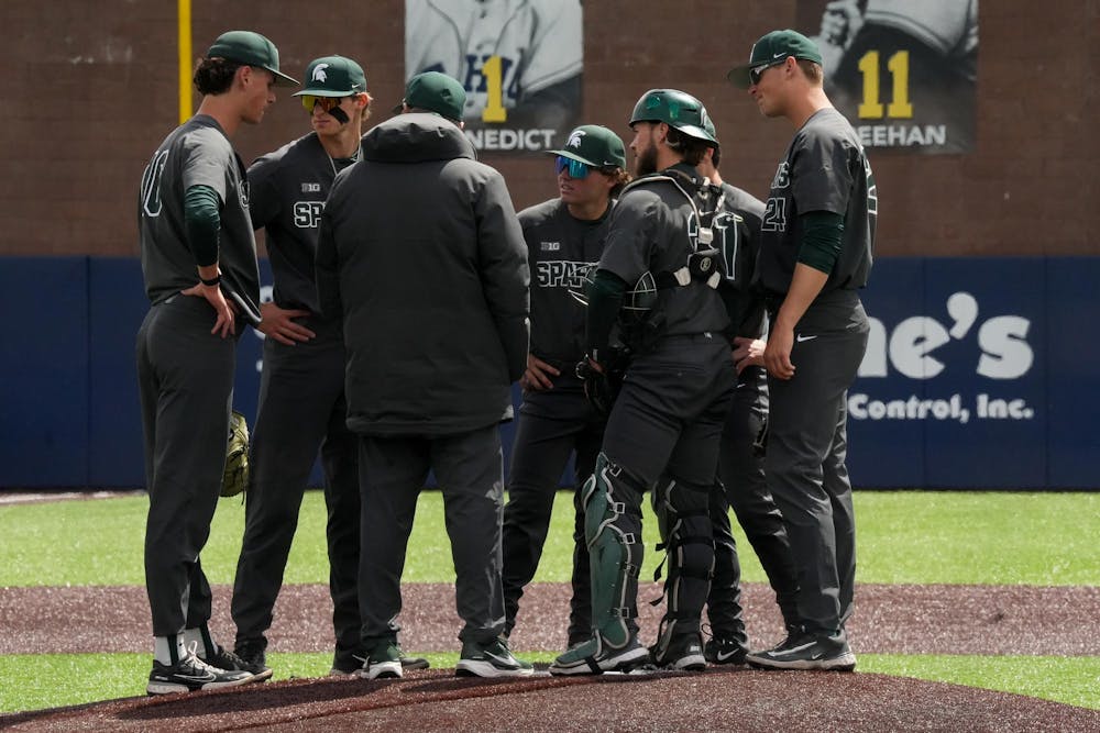 The Spartans take a time out at Ray Fisher Stadium on April 26, 2025. The Spartans lost to the Wolverines in the second game 9-2.