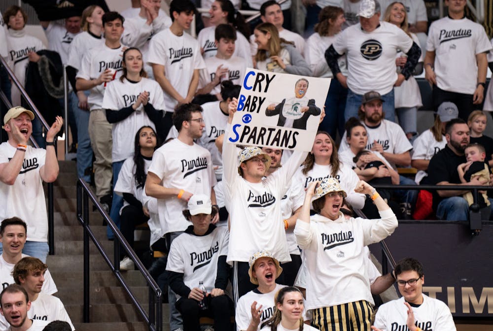 <p>A Purdue fan holds a sign that says, "Cry Baby Spartans," during a game against MSU at Mackey Arena on Jan. 29, 2023. The Spartans lost to the Boilermakers 77-61.</p>