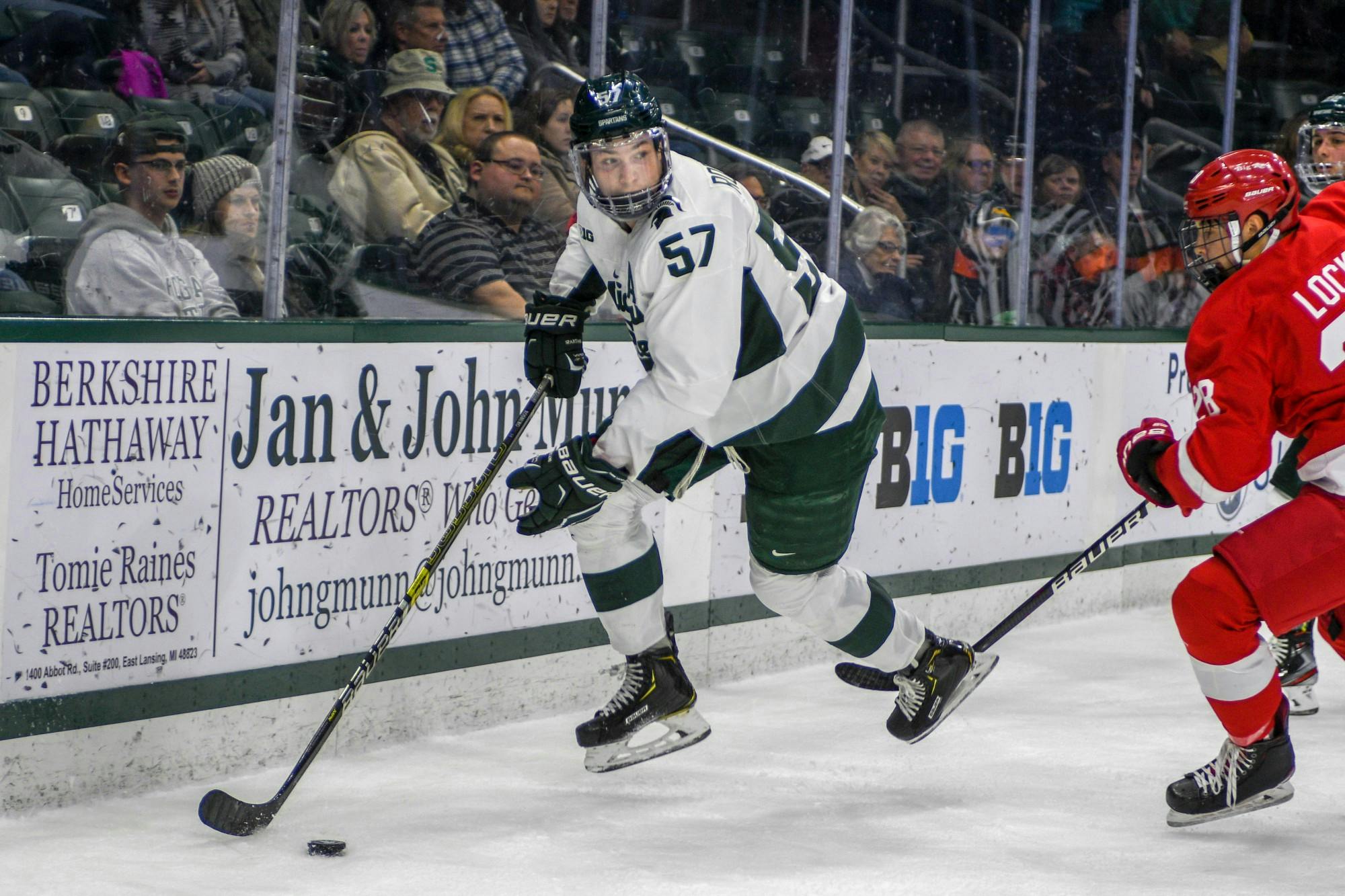 <p>Redshirt senior left defense Jerad Rosburg (57) takes the puck during the game against Cornell at Munn Ice Arena on Nov. 1, 2019. The Spartans were tied 1-1 with the Big Red at the end of the first period.</p>