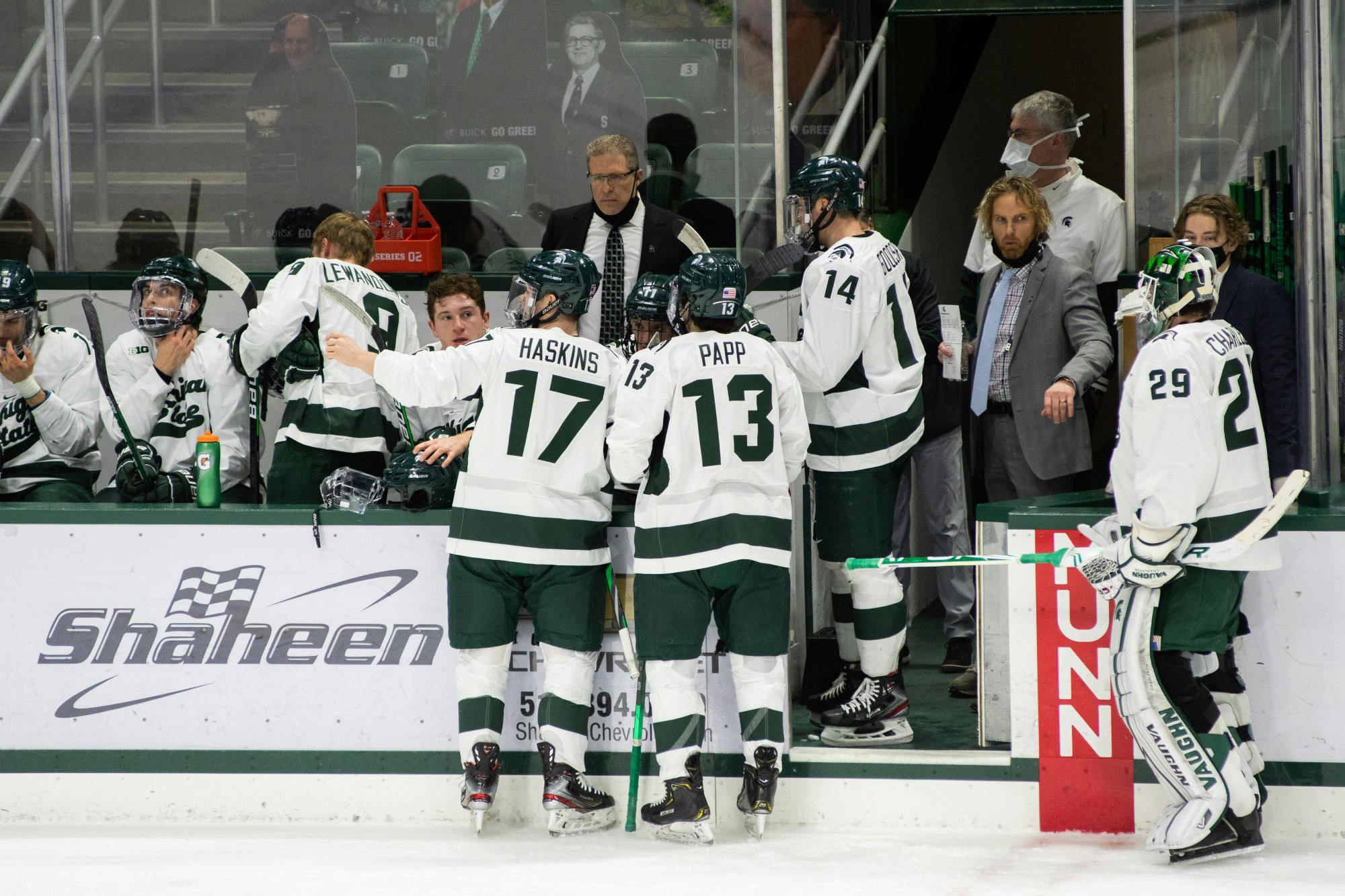 <p>The Spartans converse with Head Coach Danton Cole on the sidelines during the Spartans&#x27; loss against Notre Dame on Feb. 26, 2021.</p>