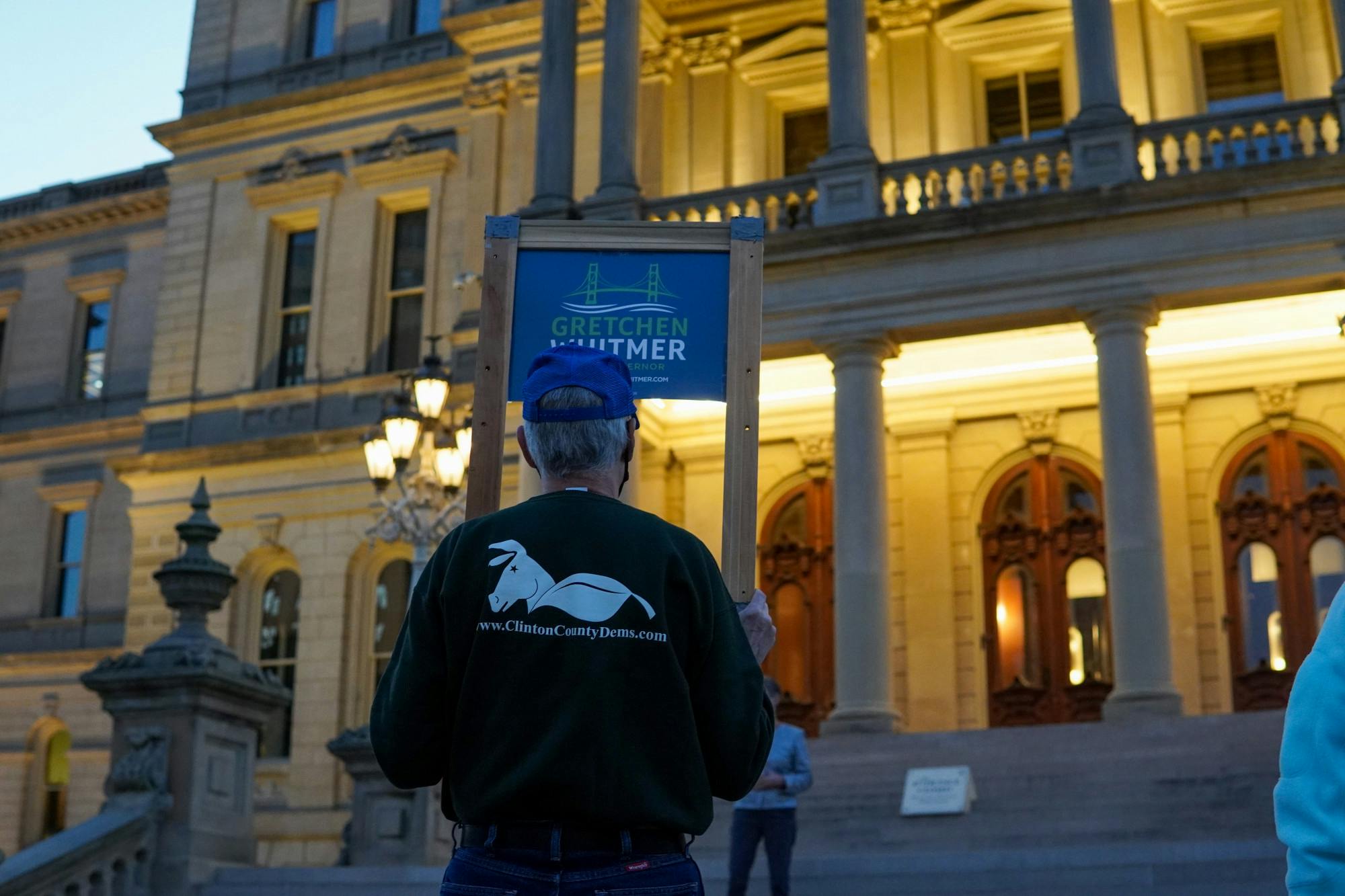 A Gretchen Whitmer supporter standing outside the Capitol on Oct. 8, 2020.