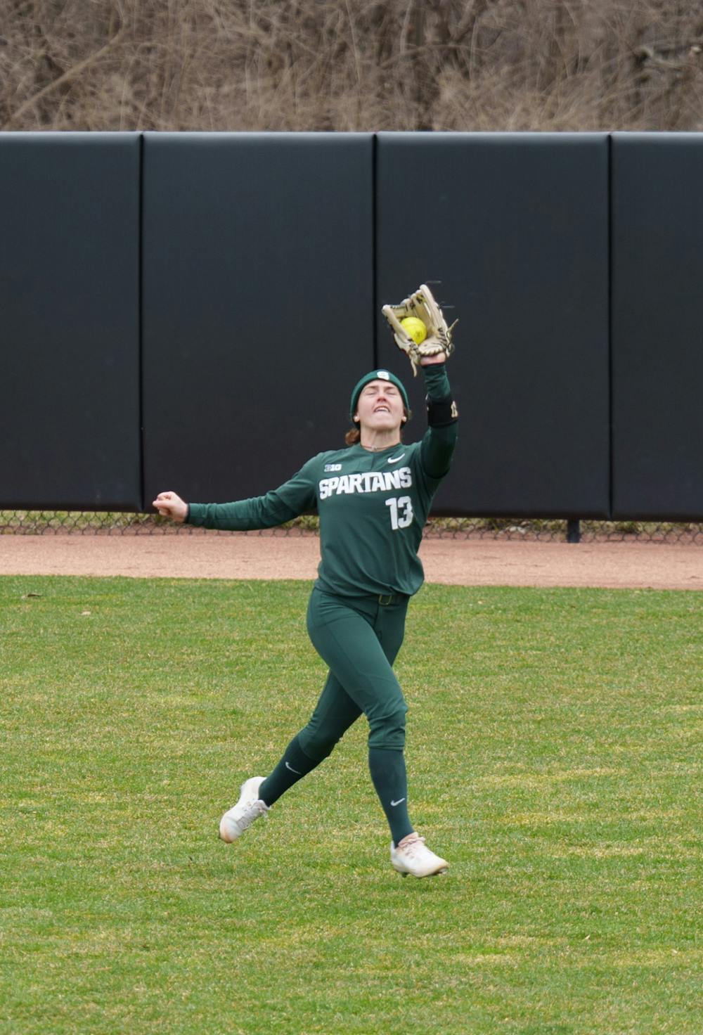 <p>Michigan State senior Abby Joseph catches the ball making another out for Nebraska. Spartans lost 6-0 against Nebraska, on April 9, 2022.</p>