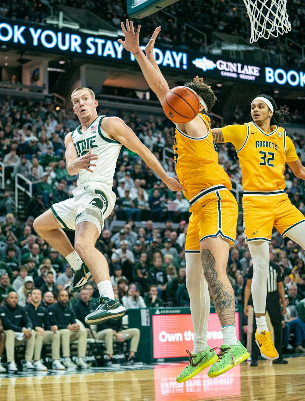 <p>MSU graduate student, Denham Wojcik (10) makes an extremely dynamic pass behind a toledo player during the MSU versus Toledo men's basketball game at the Breslin Center in East Lansing, Michigan on Tuesday, Dec. 16, 2025.</p>