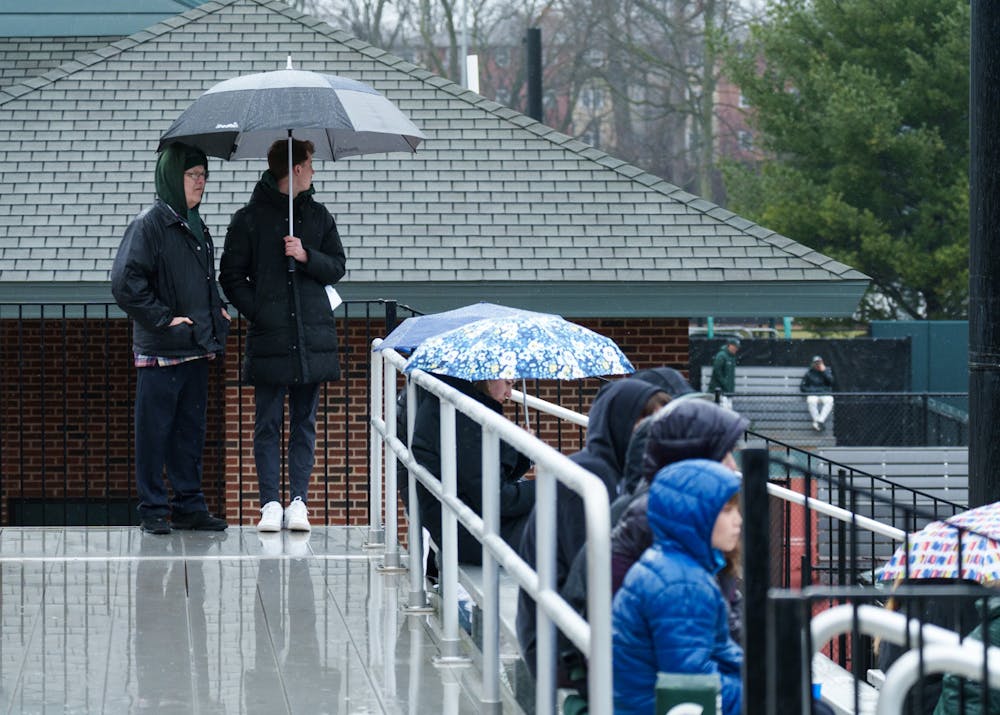 <p>Fans try to stay dry during Michigan State&#x27;s game against Youngtown State, as the rain keeps coming down at McLane Baseball Stadium on March 30, 2022. Spartans are victorious 12-5 against Youngtown State.</p>