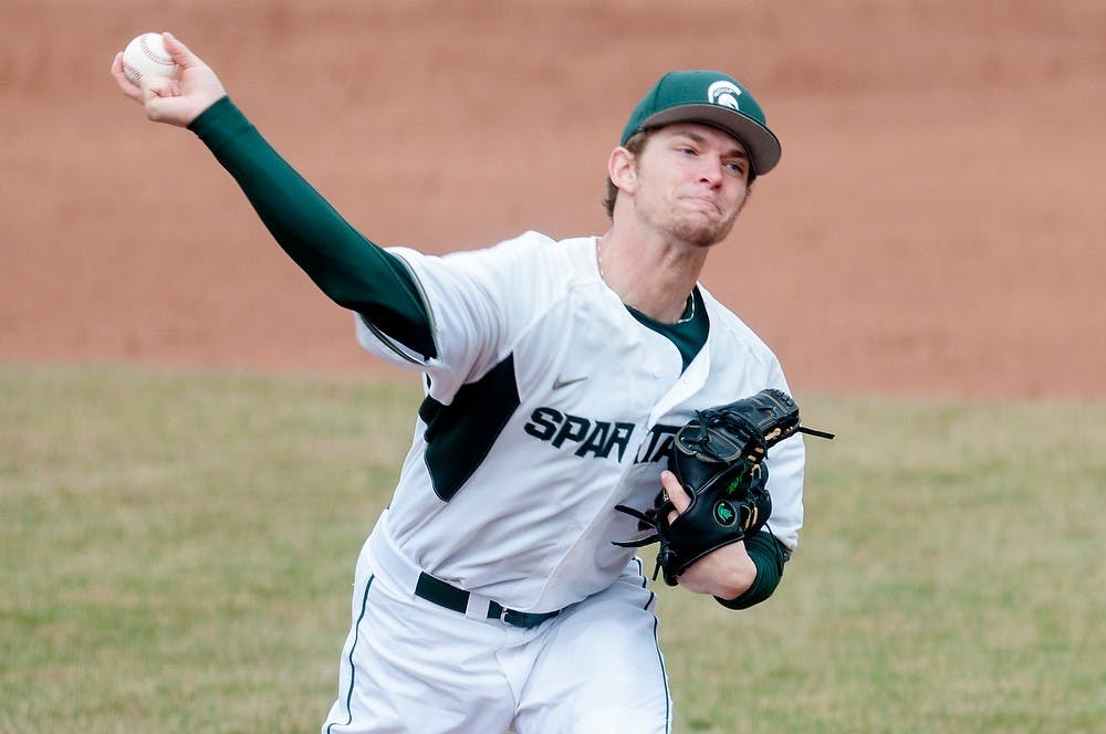 	<p>Senior pitcher Andrew Waszak pitches April 12, 2013, during the first game of a three-game series against Indiana at McLane Baseball Stadium at Old College Field. The Spartans defeated the Hoosiers, 2-1, in the first game of the series. Julia Nagy/The State News</p>