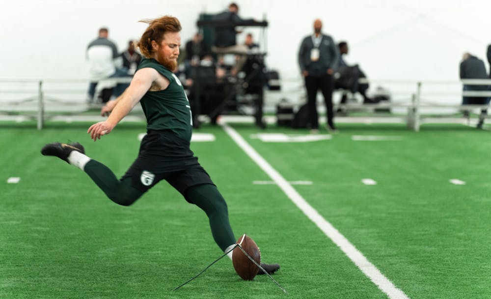 <p>Michigan State graduate student Matt Coghlin with a beautiful kick, on Mar. 16, 2022 at the Duffy Daugherty Indoor Football Building.</p>