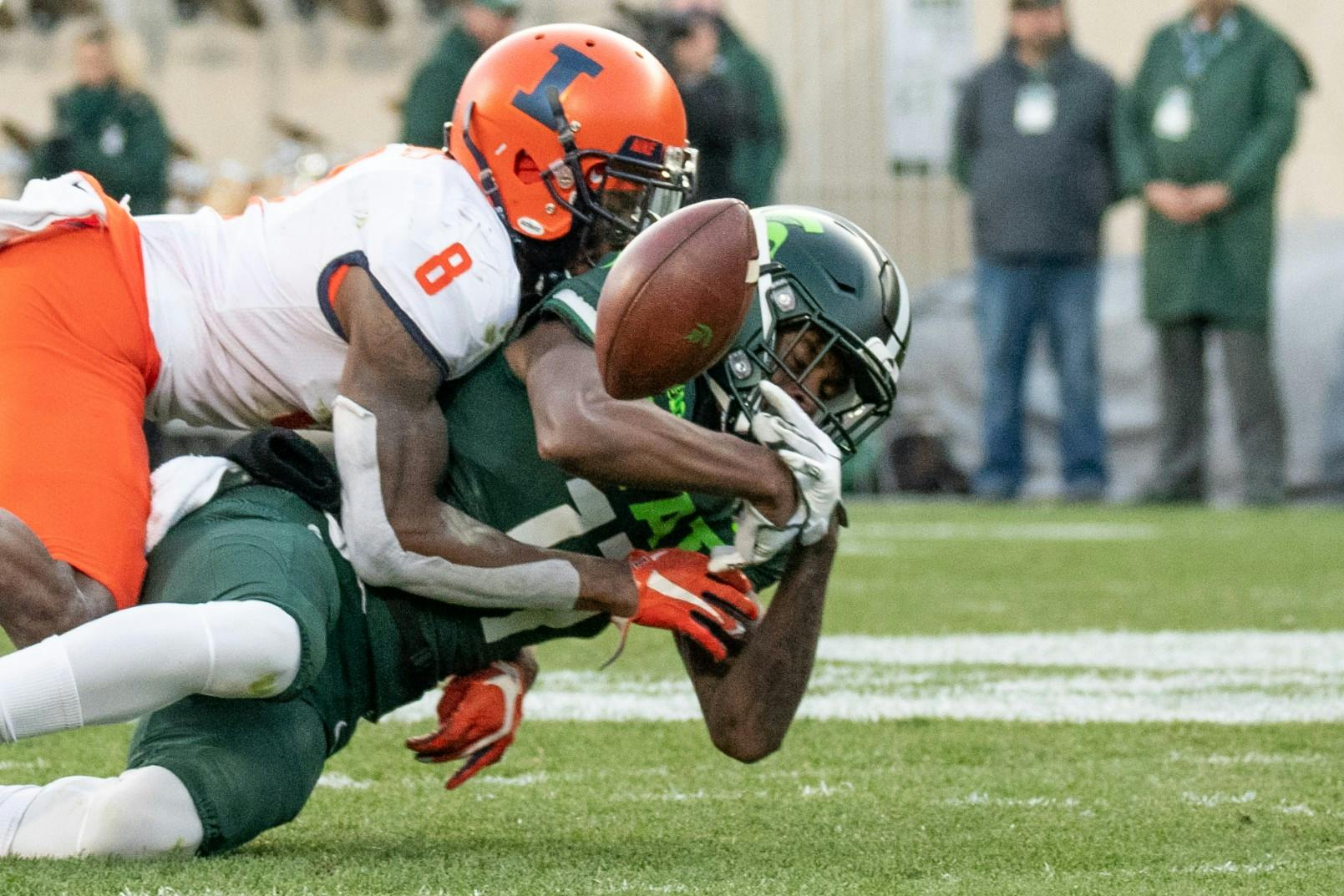 Freshman wide receiver Tre Mosley (17) tries to bring in a pass during the game against Illinois Nov. 9, 2019 at Spartan Stadium.