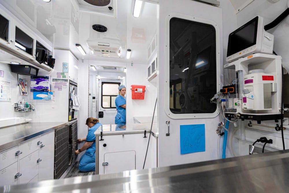 <p>MSU Licensed Veterinary Technicians Rebecca Wood (right) and Katlyn Cunningham (left) clean up the MSU Veterinary Mobile Unit after completing their operations for the day in Warren Mich., on July 16, 2026.</p>