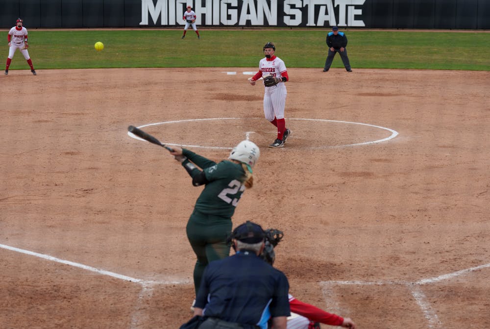 <p>Michigan State senior Jessica Mabrey hits a single in the seventh inning. Spartans lost 6-0 against Nebraska, on April 9, 2022.</p>