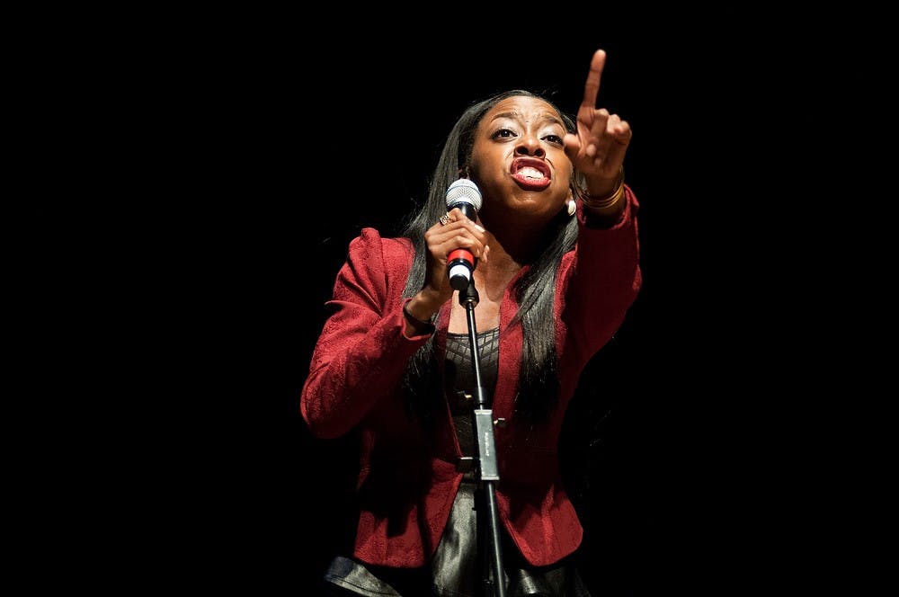 <p>Kinesiology senior Sierra Huling sings "Change Gonna Come" at the closing act of the 42nd annual Black Power Rally on Nov. 5, 2014, at the Wharton Center. Dylan Vowell/The State News</p>
