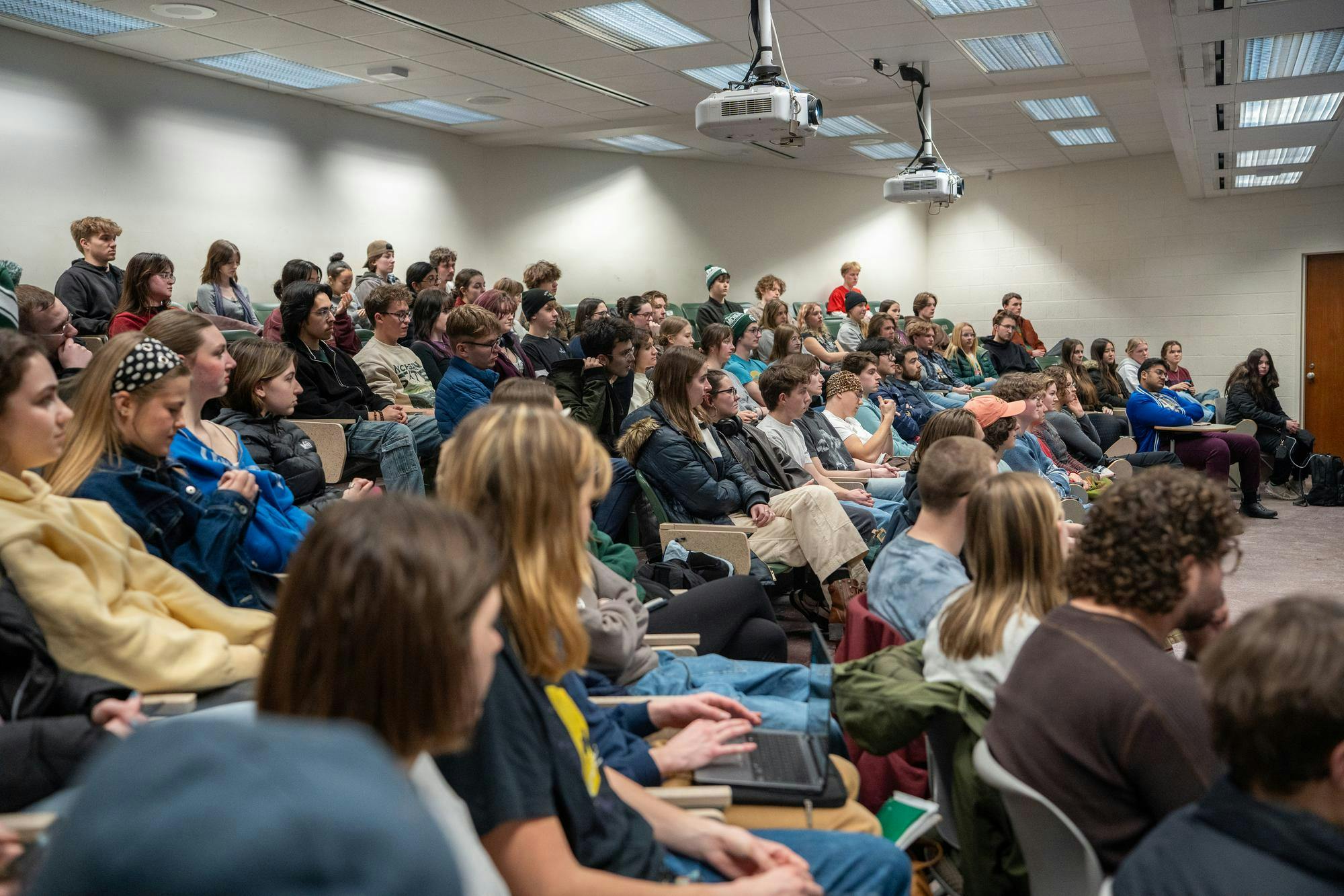 Outdoors Club members sit and listen to their guest speaker, Clint Adams, at the start of a weekly club meeting on Monday, Feb. 9, 2026, at IM West Recreational Facility in East Lansing, Mich.