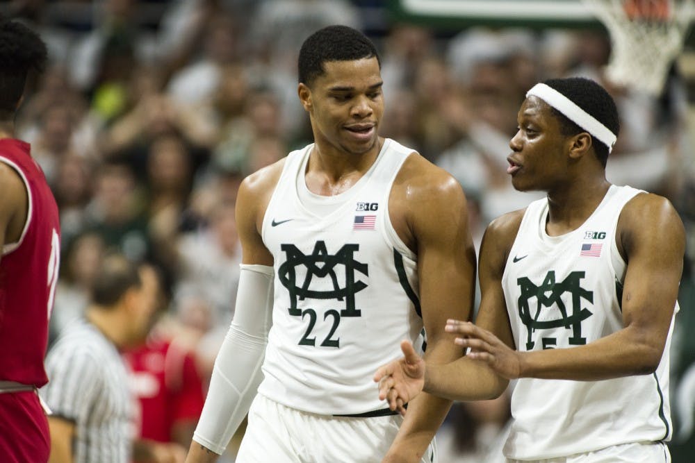 Freshman guard/forward Miles Bridges (22) and freshman forward Cassius Winston (5) share a moment during the first half of men's basketball game against the University of Wisconsin on Feb. 26, 2017 at Breslin Center. The Spartans defeated the Badgers, 84-74.