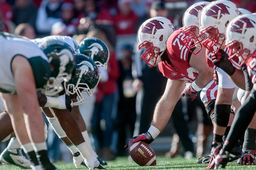 Members of the Spartan football team lineup against the Badger football team Saturday, Oct. 27, 2012, at Camp Randall Stadium in Madison, Wis. The Spartans defeated the Wisconsin Badgers 16-13 with an overtime touchdown for the win. Adam Toolin/The State News