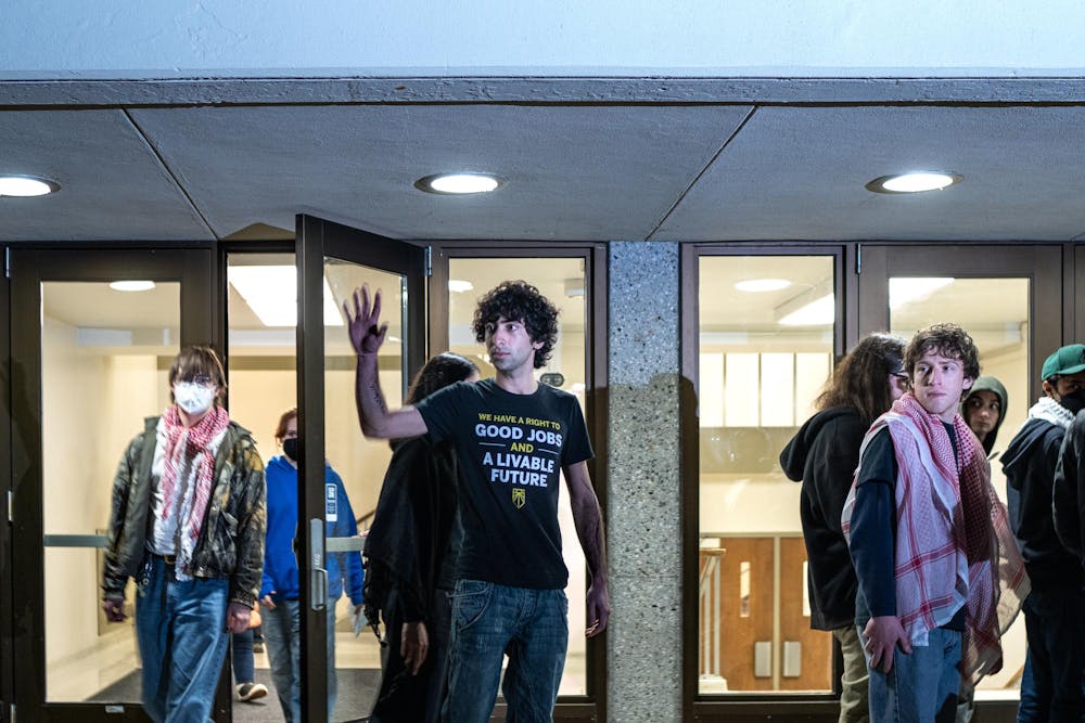 <p>The 19 members of the Hurriya Coalition and Michigan State Sunrise arrested leave the Hannah Administration Building in East Lansing, Michigan on April 11, 2025. Members of MSU Sunrise and the Hurriya Coalition protested in the lobby where 19 protestors were arrested after multiple warnings from the police and given misdemeanor trespassing tickets.</p>