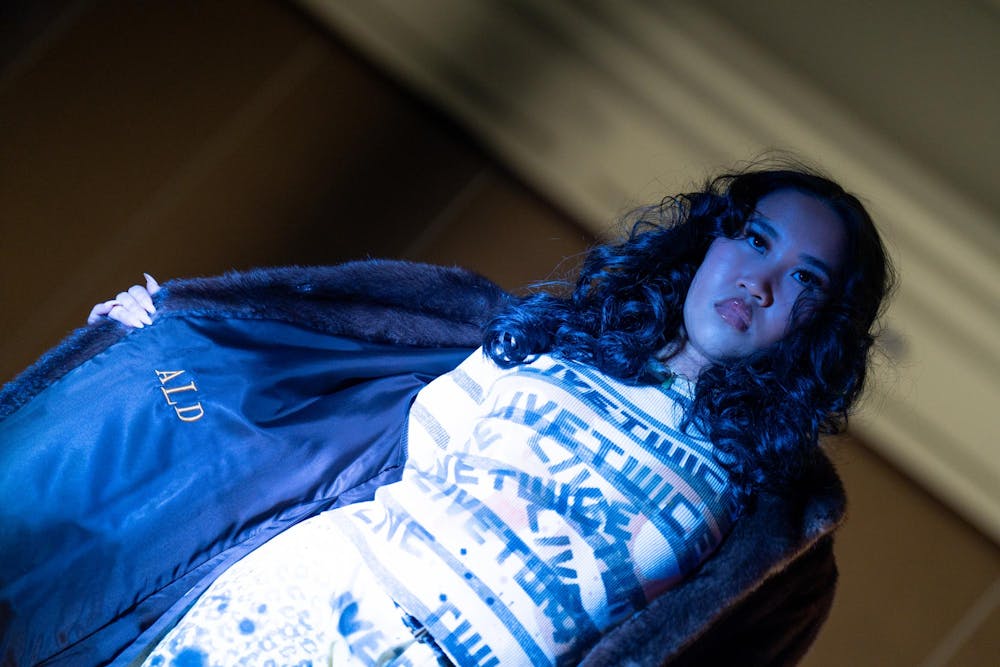 A model poses during N Crowd magazine’s fall fashion show at The Lansing Center on Dec. 8, 2024. N Crowd, a fashion magazine and non-profit organization for creatives at MSU, holds a fashion show every semester.
