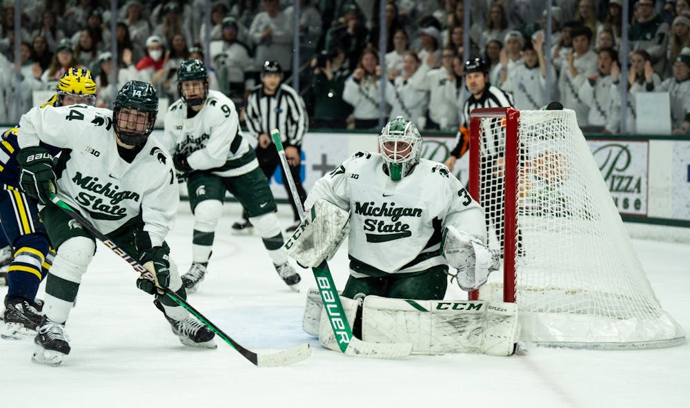 <p>Graduate student goalkeeper Dylan St. Cyr (37) watches the puck during a game against the University of Michigan at Munn Ice Arena on Dec. 9, 2022. The Spartans defeated the Wolverines 2-1. </p>