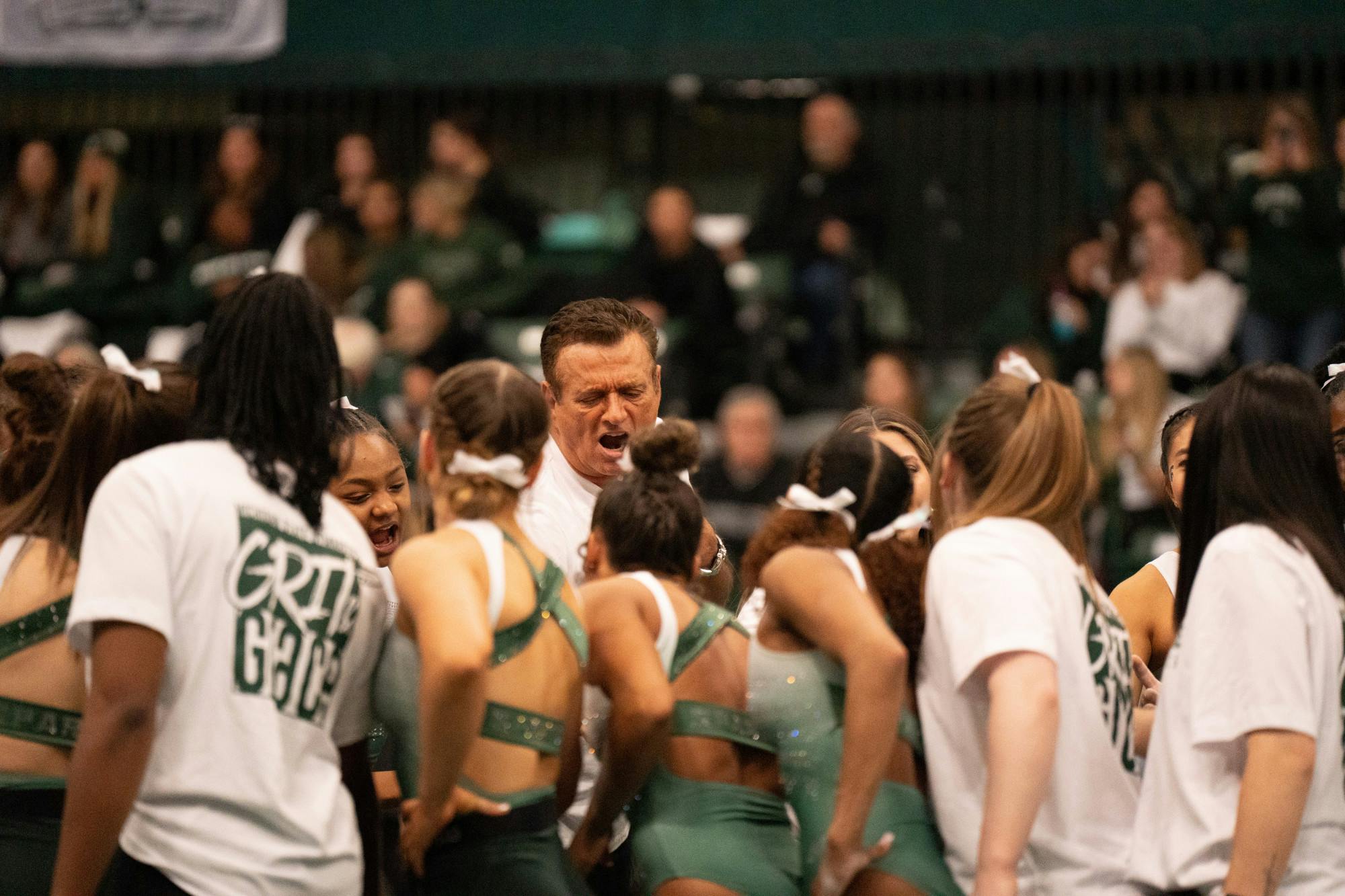 Head coach Mike Rowe during a team circle before the beginning of the MSU V. Penn State meet, held at the Jenison Fieldhouse on Feb.4, 2022