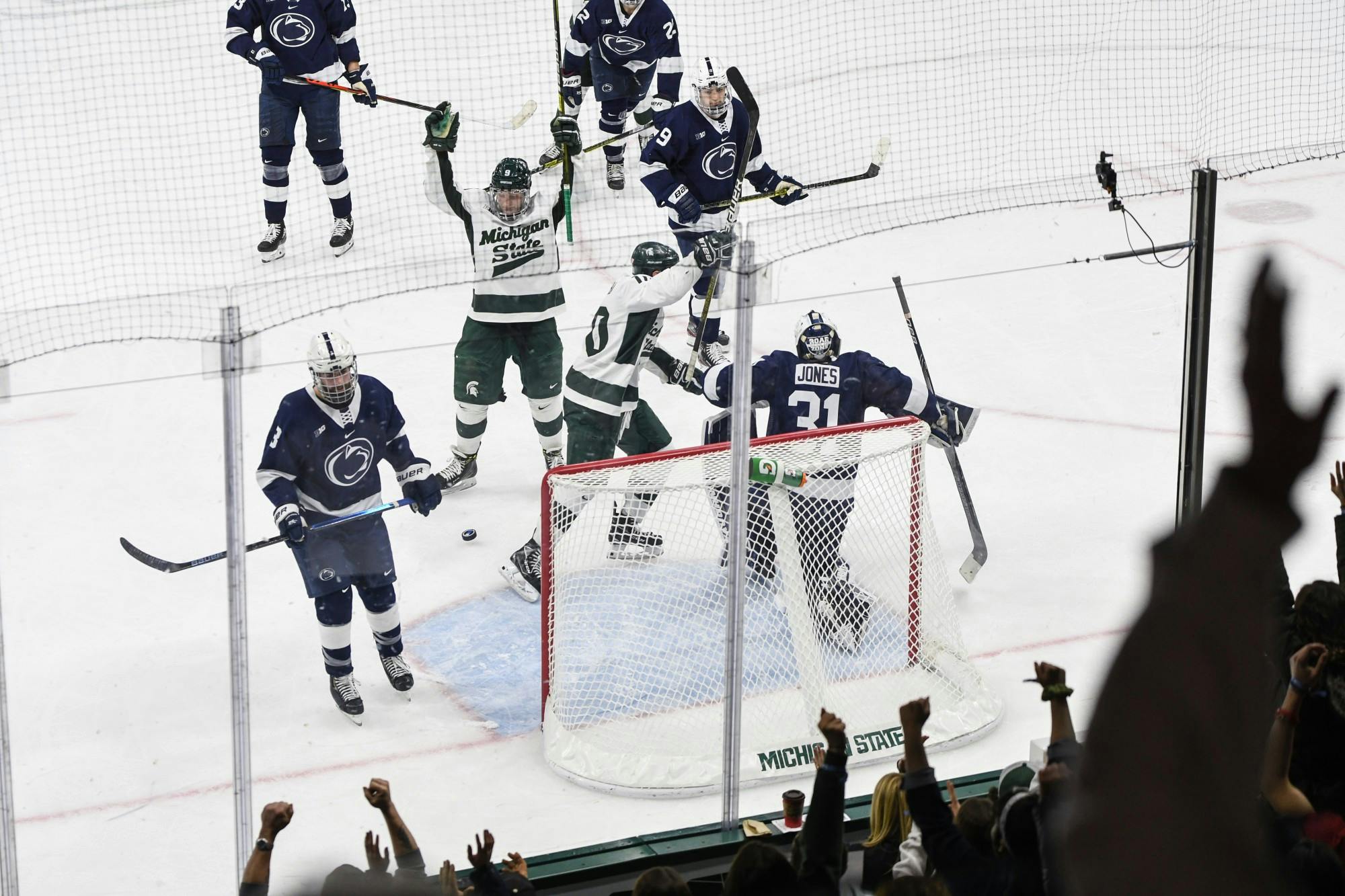 <p>Spartan athletes and fans celebrate a goal during a hockey game against Penn State on Jan. 24, 2020, at Munn Ice Arena. The Spartans defeated the Nittany Lions, 4-2.</p>
