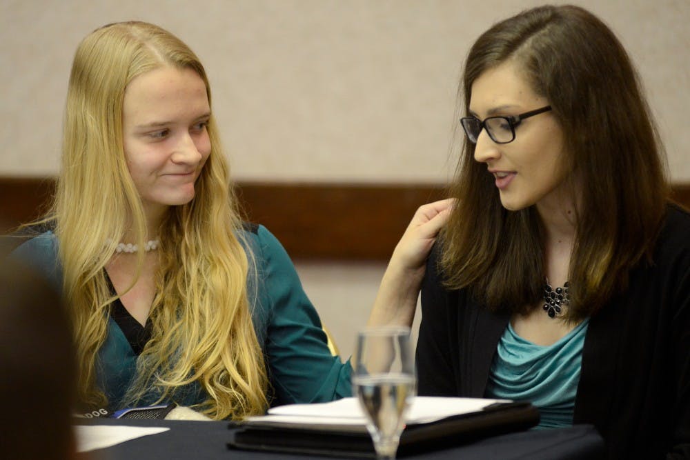<p>Emily Kollaritsch, left, comforts Shayna Gross after Gross made a statement regarding her alleged assault during a press conference on Nov. 18, 2015 at the Marriott in East Lansing. Kollaritsch and Gross were students at MSU when they were allegedly assaulted. Four individuals, including Kollaritsch and Gross,&nbsp;filed a Title IX campus sexual assault civil lawsuit against the Michigan State University, which alleges that MSU failed to adequately investigate complaints of sexual assault. </p>