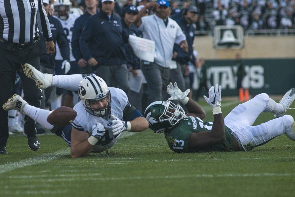 Brigham Young tight end Troy Hinds (44) fails to make a catch while being covered by sophomore center back Vayante Copeland (13) during the game against Brigham Young University on Oct. 8, 2016 at Spartan Stadium.  The Spartans were defeated by the Cougars, 31-14. 