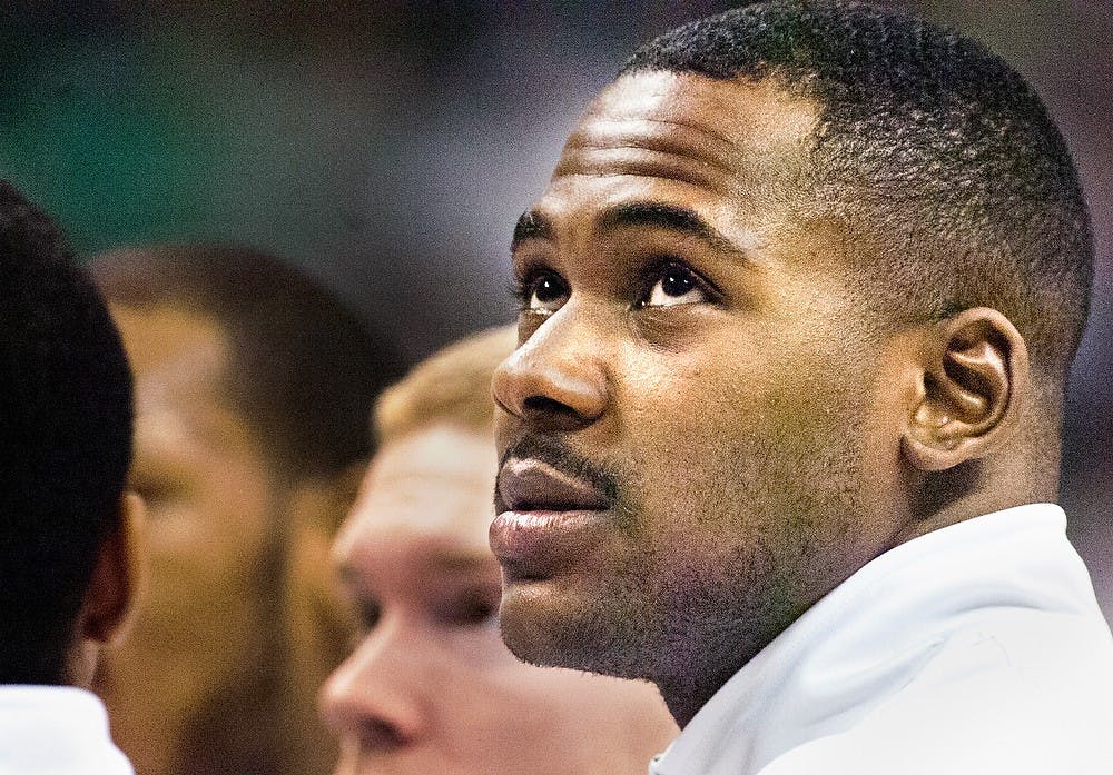 	<p>Senior center Derrick Nix looks up at the crowd from the team huddle at the game against Louisiana-Lafayette on Sunday, Nov. 25, 2012, at Breslin Center. The Spartans overcame 20 turnovers to take the 63-60 win. Katie Stiefel/ State News</p>