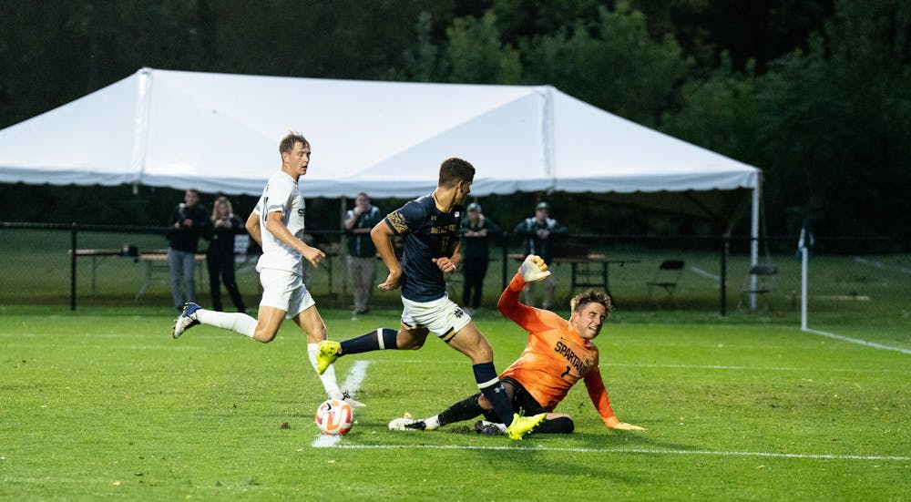 <p>Senior goalkeeper Owen Finnerty makes a save during the matchup versus Notre Dame on Aug. 29, 2022.</p>