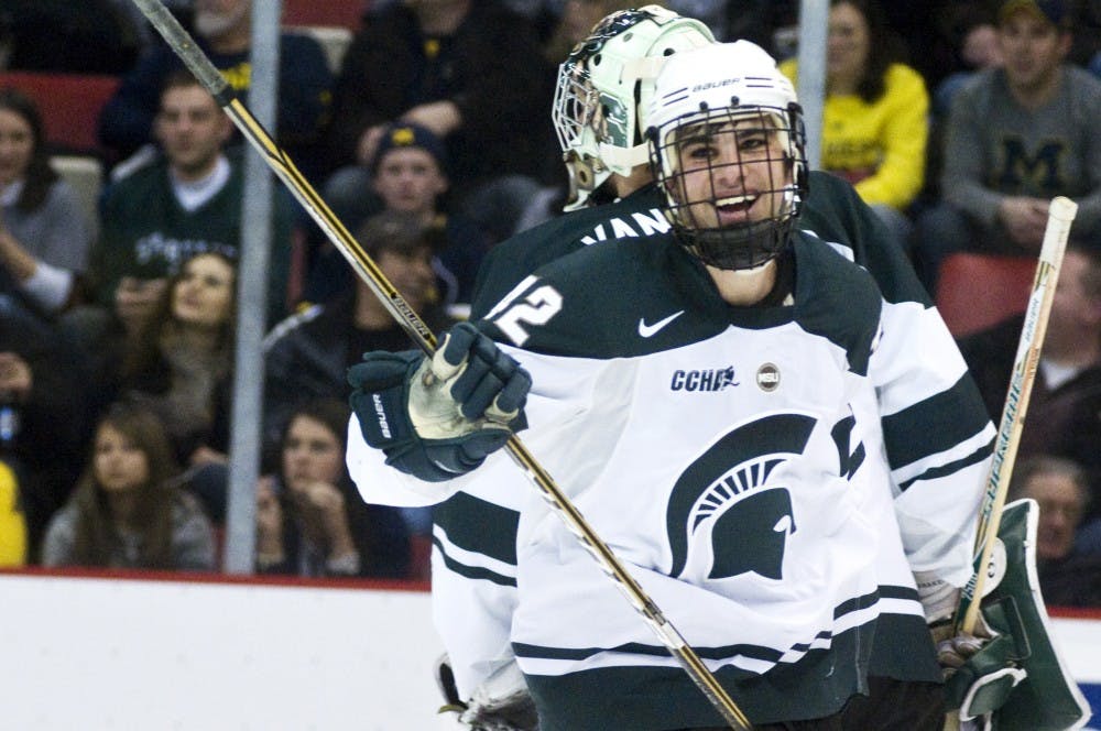 Freshman left wing Jake Chelios smiles after scoring against Michigan Saturday night at Joe Louis Arena. Chelios scored the first goal for the Spartans, helping them to defeat the Wolverines 2-1. Matt Hallowell/The State News