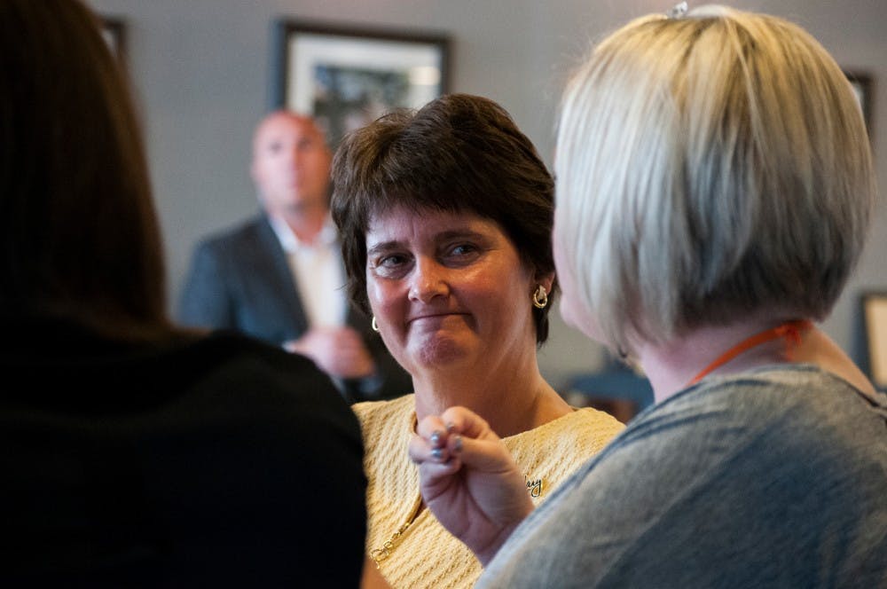 Anne Holton, wife of vice presidential candidate Tim Kaine, visits with supporters on Sept. 28, 2016 at the Red Cedar Cafe.  