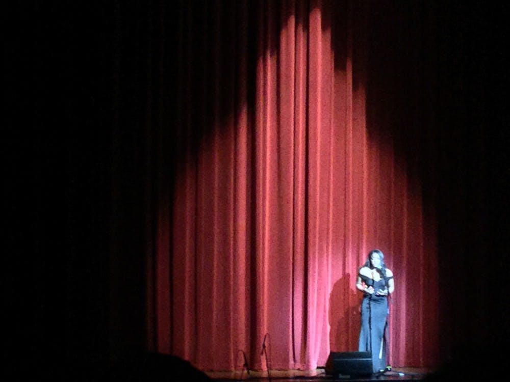 A student performs her spoken word piece at the Black Power Rally on Sunday. Photo by Maxwell Evans.