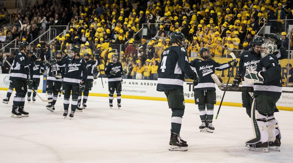 <p>Michigan State men’s hockey players celebrate after defeating the University of Michigan 3-1 at the Yost Ice Arena in Ann Arbor, Mich. on Dec. 6, 2025.</p>