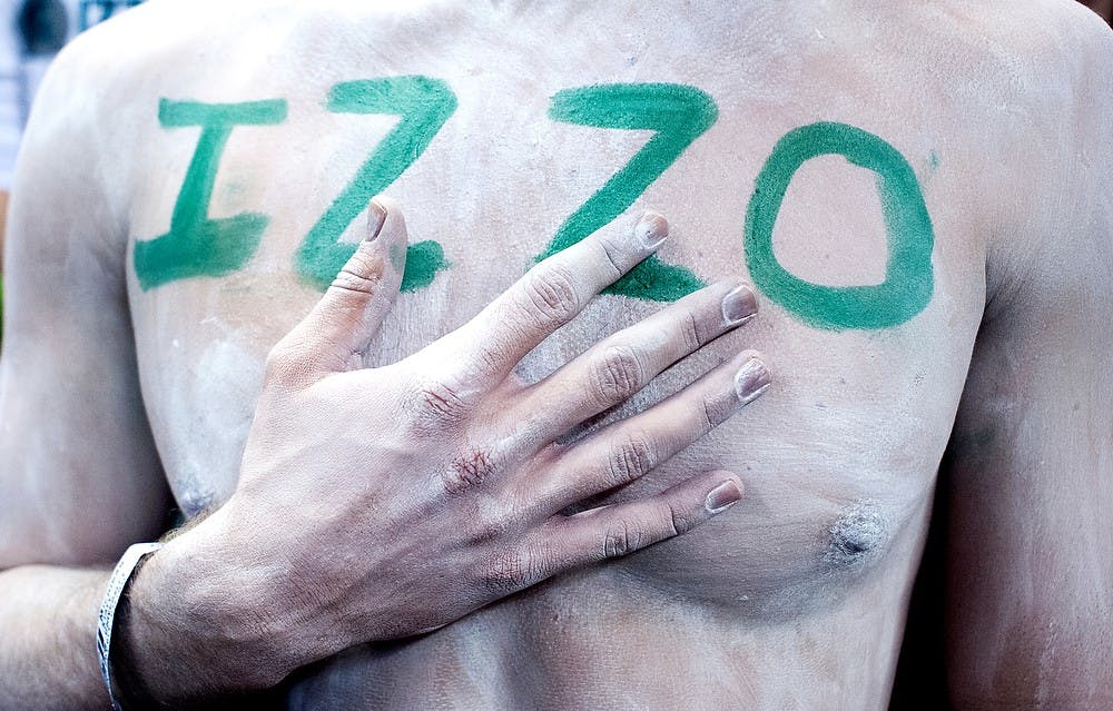 	<p>With &#8216;Izzo&#8217; written on his chest, then-marketing junior Wilson Shaner stands for the national anthem during a game in the 2012-13 season. <span class="caps">MSU</span> defeated Michigan, 75-52, on Feb. 12. Justin Wan/The State News</p>