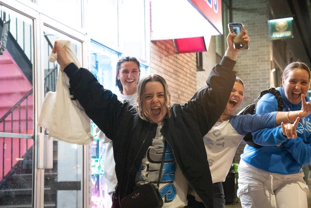 <p>A group of Detroit Lions fans keep their heads held high in downtown East Lansing after the team's 31-34 loss against the San Francisco 49ers on Jan 28, 2024.</p>