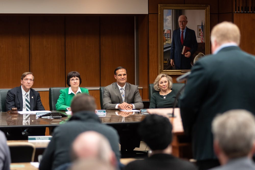 <p>Athletic Director Bill Beekman (right) addresses the Board of Trustees in regards to the selection process for Michigan State’s new head football coach, Mel Tucker, at the Hannah Administration Building on Feb. 12, 2020. </p>
