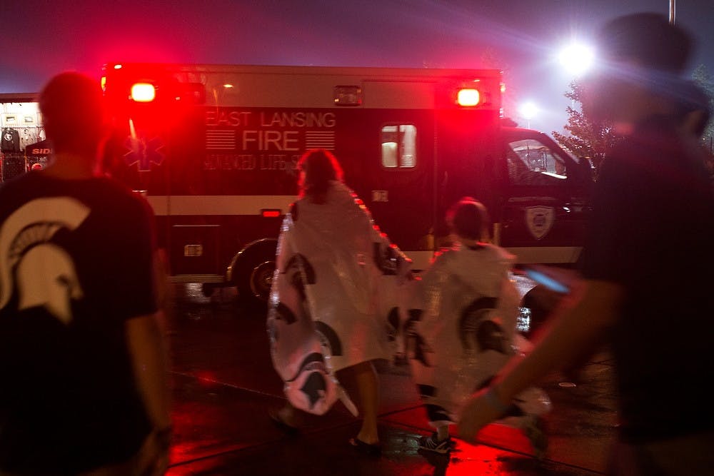 	<p>Attendees evacuate Spartan Stadium after severe weather caused lightning strikes in the area during the game against Western Michigan on Aug. 30, 2013. Julia Nagy/The State News</p>