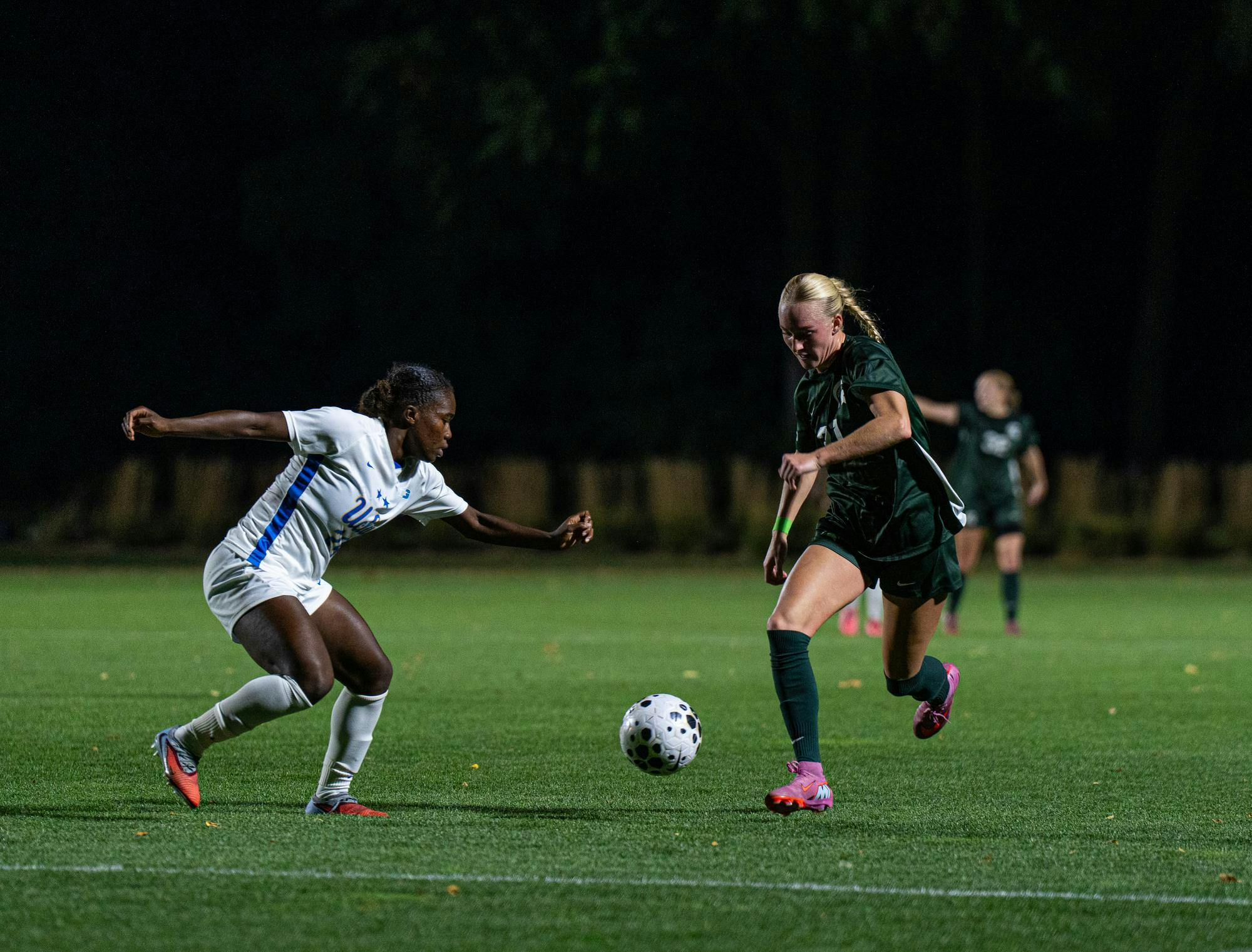 <p>Defender Ava Lutke (31) runs down the field with forward Payten Cooper of UCLA (24) on the charge during the matchup against Michigan State at DeMartin Stadium, East Lansing 9/18/2025.</p>