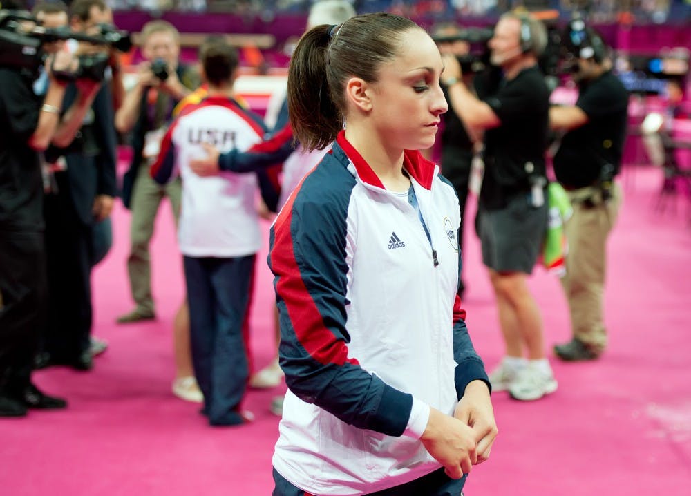 Jordyn Wieber of the United States, walked back to her seat after congratulating teammate Alexandra Raisman on her gold medal in the women's floor exercises apparatus finals at North Greenwich Arena during the 2012 Summer Olympic Games in London, England, Tuesday, August 7, 2012. Wieber finished seventh in the competition. (David Eulitt/Kansas City Star/MCT)