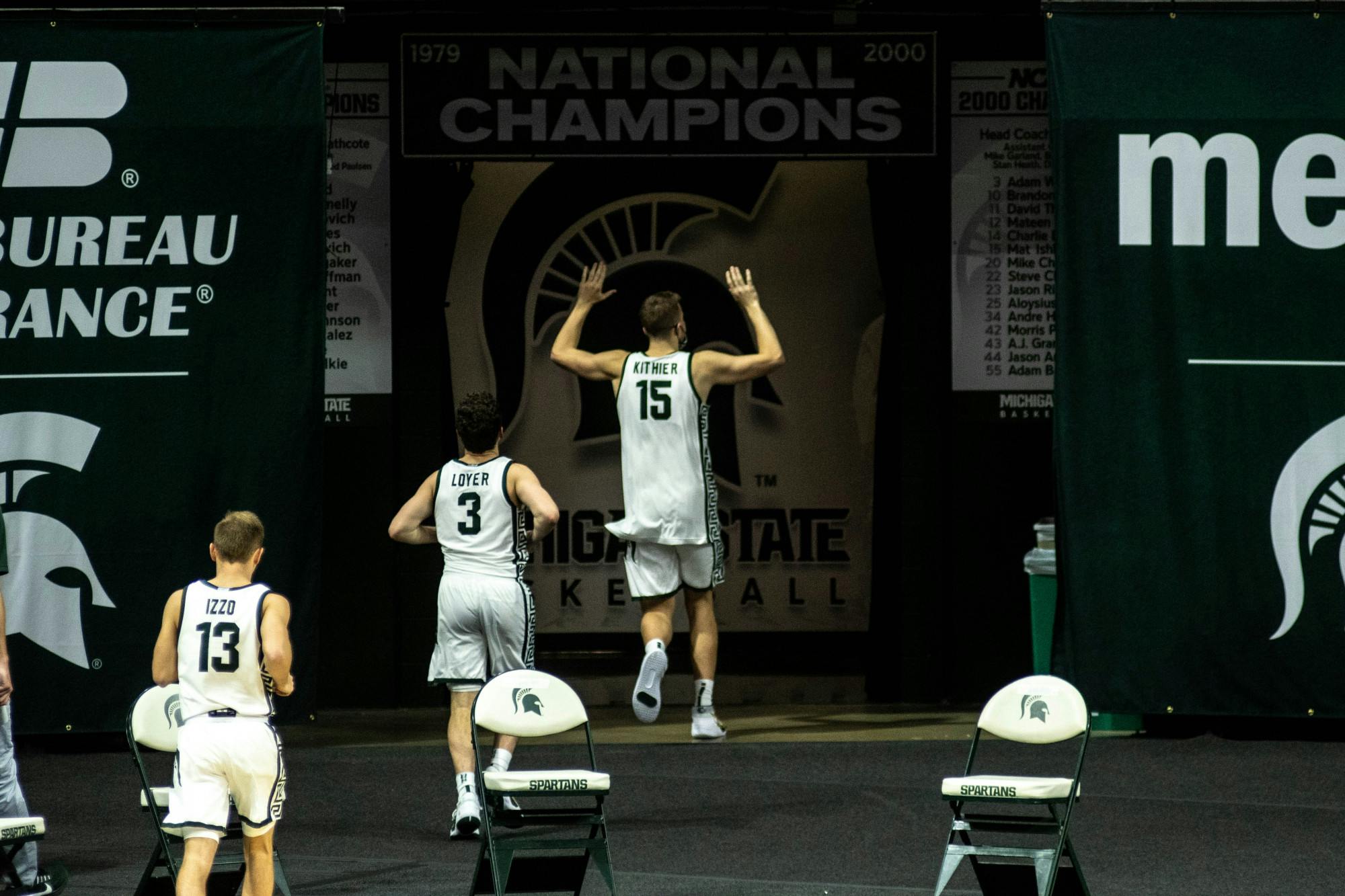 The Spartans run off the court after winning  the game against Eastern Michigan on Nov. 25, 2020 at the Breslin Center. The Spartans defeated the Eagles, 83-67.