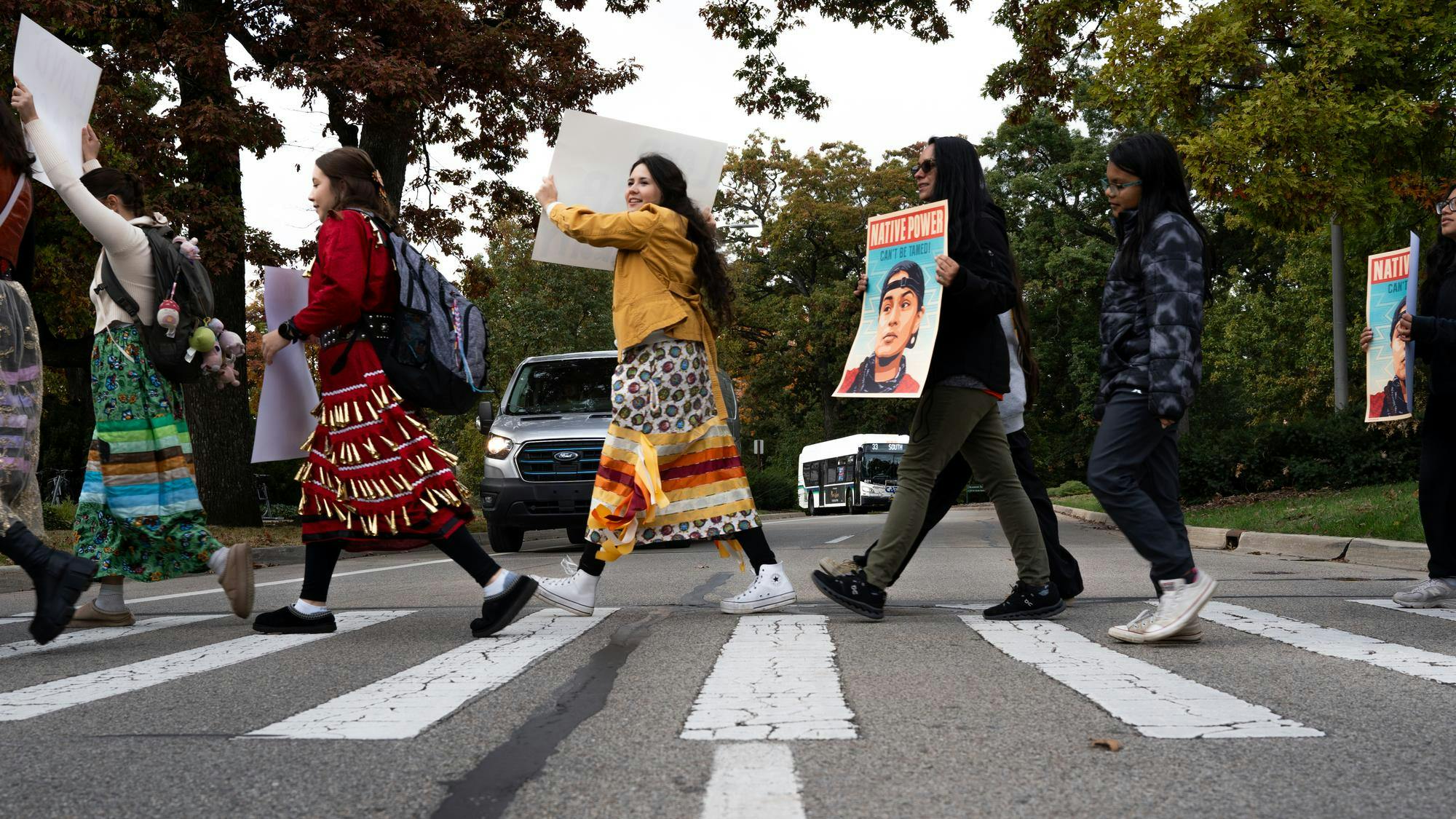 Members of Michigan State University indigenous communities march across MSU's campus commemorating Indigenous Peoples Day, Oct. 14, 2024. The march across campus was hosted by the North American Indigenous Student Organization and critiqued the University's prideful position as the United States' first land grant university. 