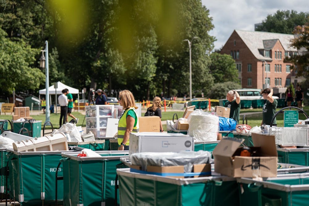 <p>Filled student move-in carts wait outside filled with items during fall move-in at Yakeley Hall in East Lansing, Mich., on Aug. 25, 2026.</p>