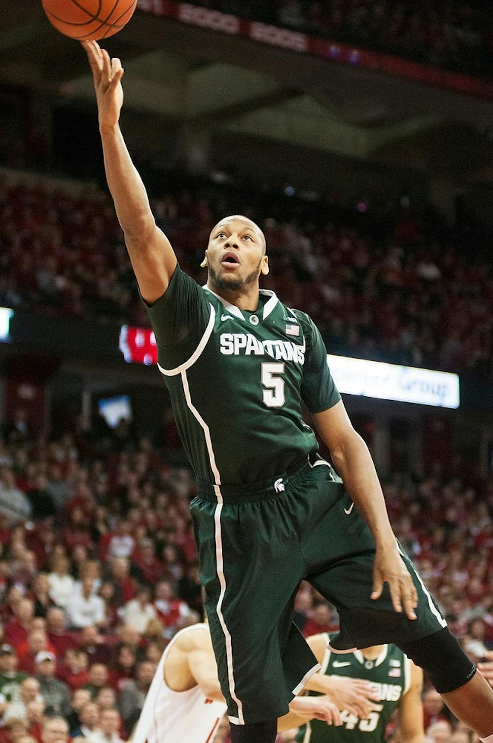 	<p>Senior center Adreian Payne takes a shot during the game against Wisconsin on Feb. 9, 2014, at Kohl Center in Madison, Wis. The Spartans lost to the Badgers, 60-58. Danyelle Morrow/The State News</p>