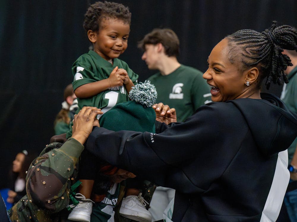<p>Retoshia Brown and her family laugh together after Michigan State’s meet against Brown at Jenison Field House in East Lansing, Mich., on Sunday, March 15, 2026.</p>