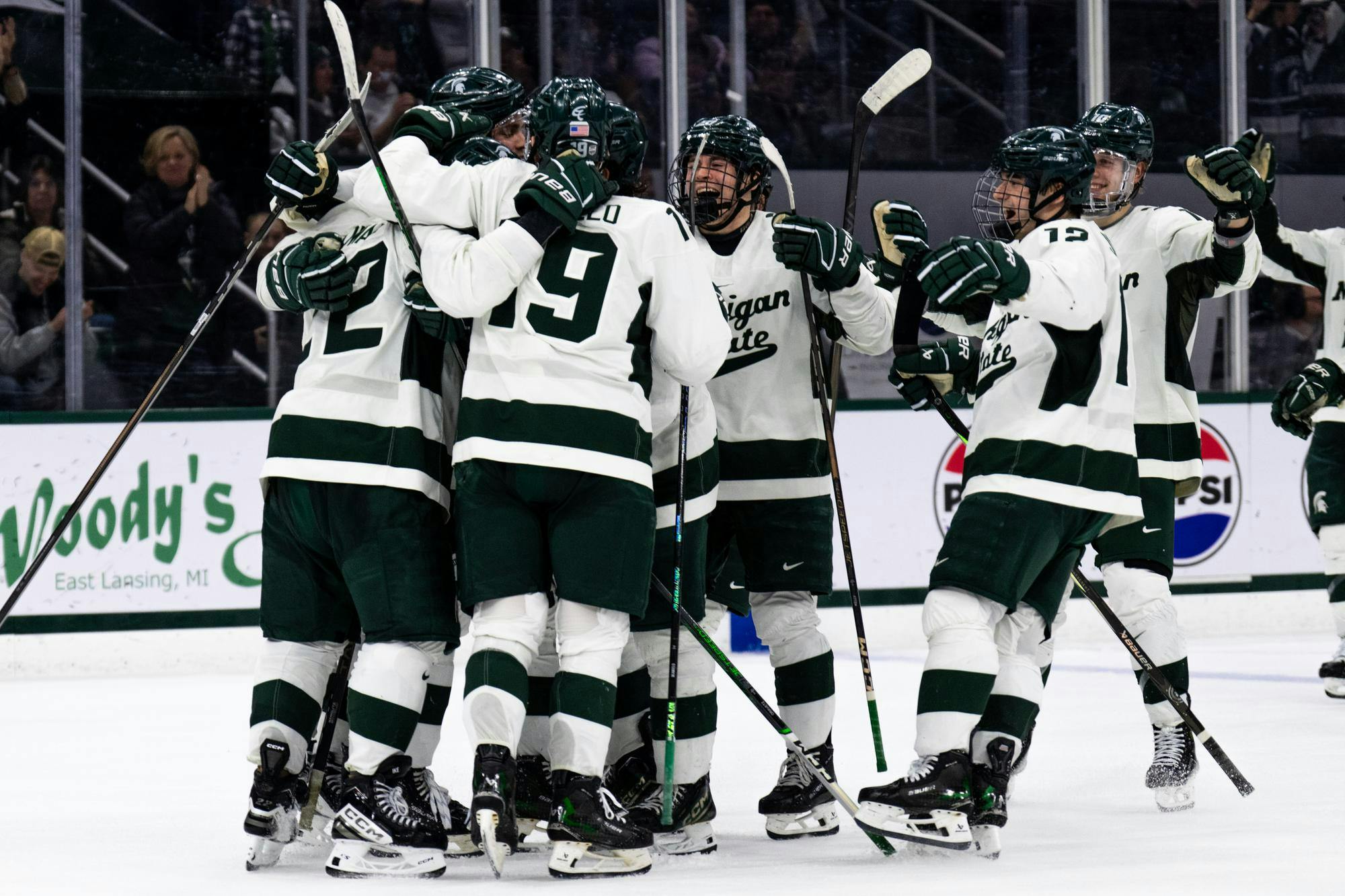 Michigan State men's hockey players celebrate their shootout over the University of Minnesota at Munn Ice Arena on Jan. 25, 2025. The Spartans completed the season sweep of the Golden Gophers following a 4-3 shoot out victory.