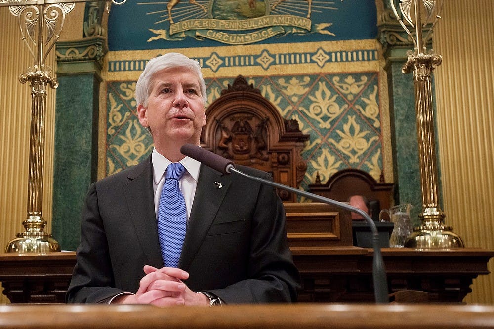 <p>Michigan Governor Rick Snyder addresses the audience Jan. 20, 2015, during the State of the State Address at the Capitol in Lansing, Michigan. Emily Nagle/The State News</p>
