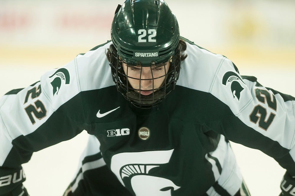 <p>Senior forward Lee Reimer lines up for a face-off during the game against Michigan on March 7, 2014, at Yost Ice Arena in Ann Arbor, Mich. The Spartans were defeated by the Wolverines, 7-1. Danyelle Morrow/The State News</p>