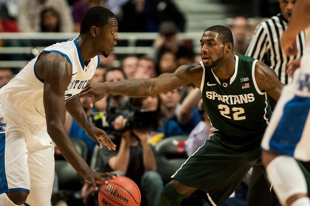 	<p>Junior forward Branden Dawson defends Kentucky forward Julius Randle during the game against Kentucky on Nov. 12, 2013, during the Champions Classic at The United Center in Chicago, IL. The Spartans defeated the Wildcats, 78-74. Khoa Nguyen/The State News</p>