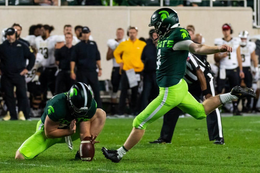 Junior kicker Matt Coghlin (right) kicks a field goal against Western Michigan The Spartans defeated the Broncos, 51-17, at Spartan Stadium on September 7, 2019. 