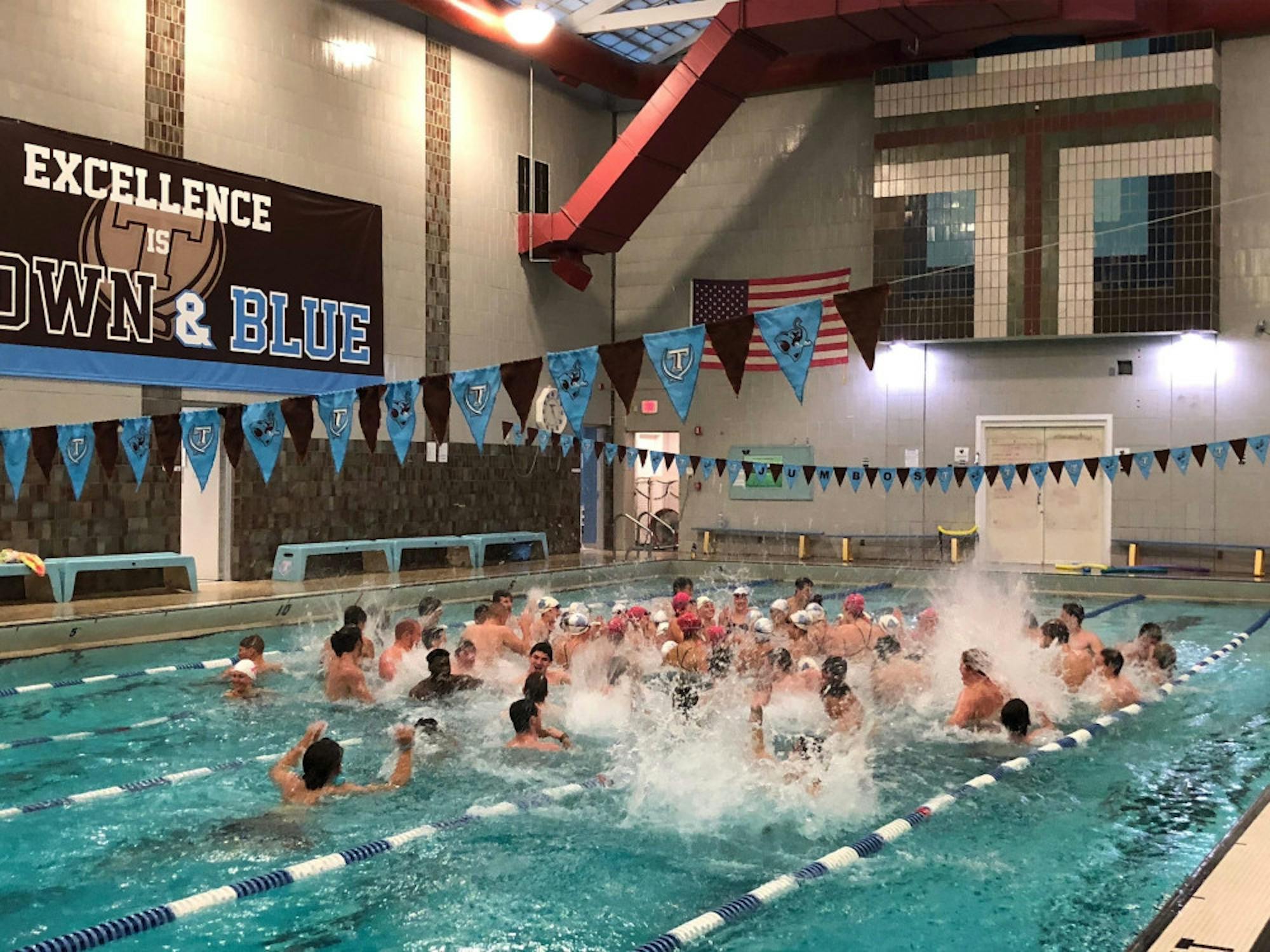 members_of_the_men_s_lacrosse__football_and_women_s_swimming_team_celebrate_after_the_2018_swimathon__lomax_turner_tufts_men_s_swimming_team_