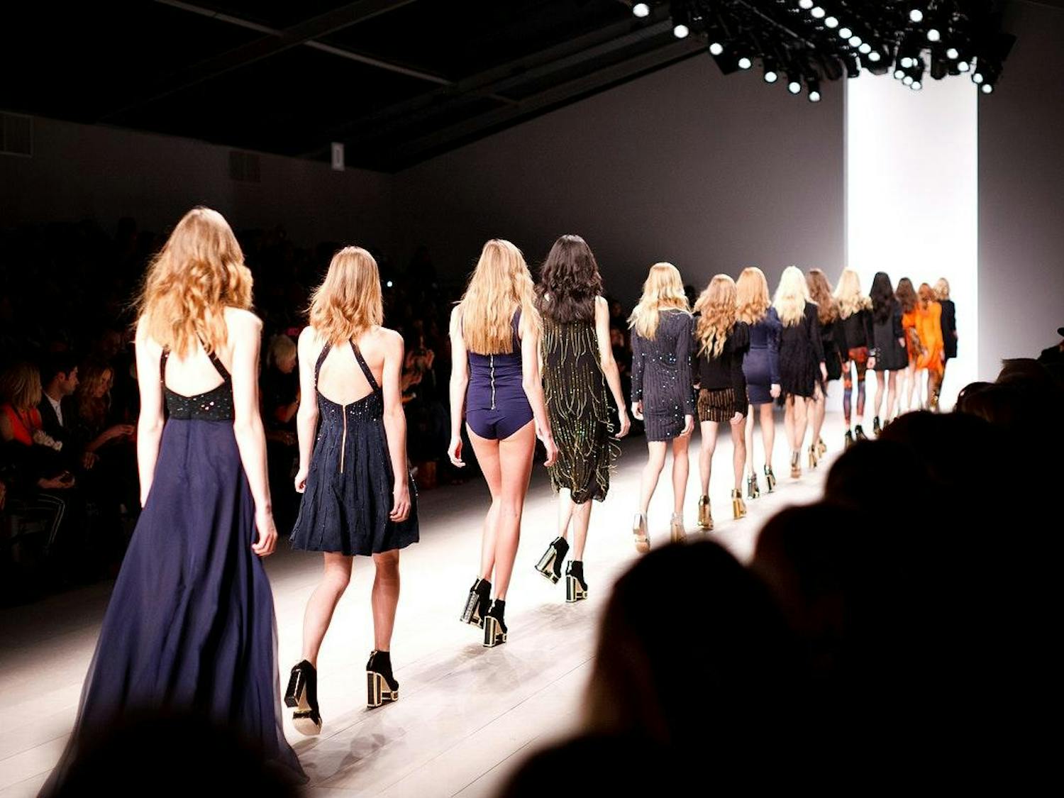 A long line of models on the catwalk.