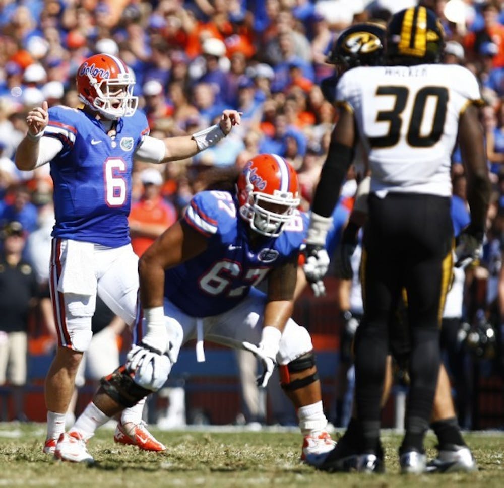 <p><span>Quarterback Jeff Driskel signals to the Gators’ offense in Florida’s 14-7 win against Missouri on Saturday at Ben Hill Griffin Stadium. UF went to a hurry-up attack on its first two possessions.&nbsp;</span></p>
<div><span><br /></span></div>